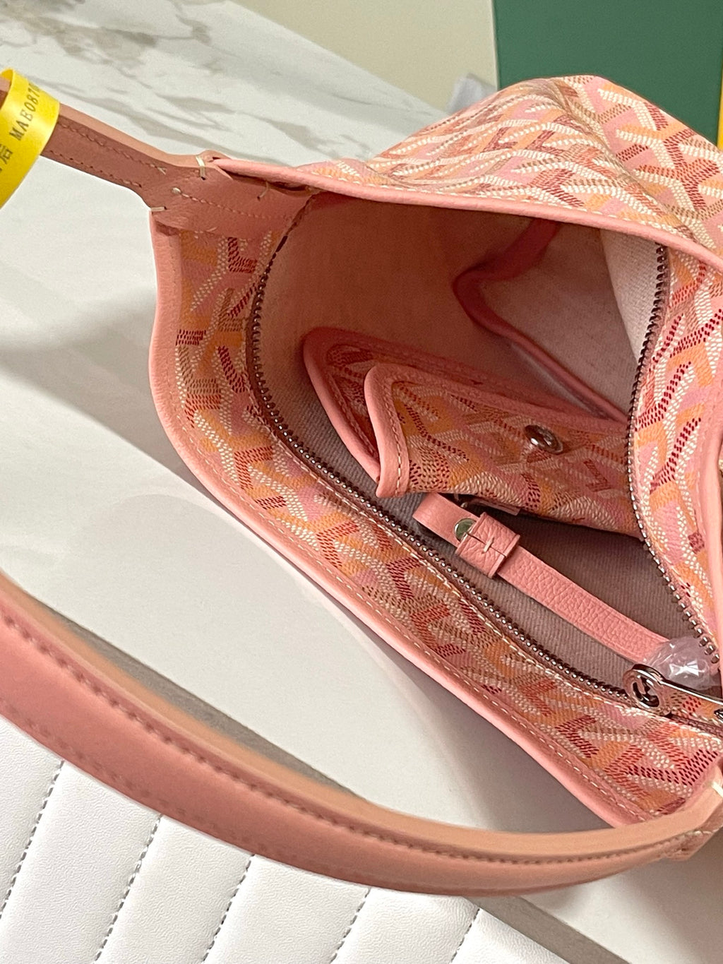 Goyard pink patterned tote with open top and lined interior pocket