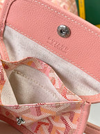 Goyard pink canvas-lined interior pocket with snap button