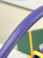 Goyard blue leather handle with contrast stitching along the edge