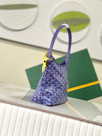 Goyard blue monogram hobo bag with curved handle and yellow accent