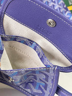 Goyard blue monogram bag interior with cream lining and snap-button detail