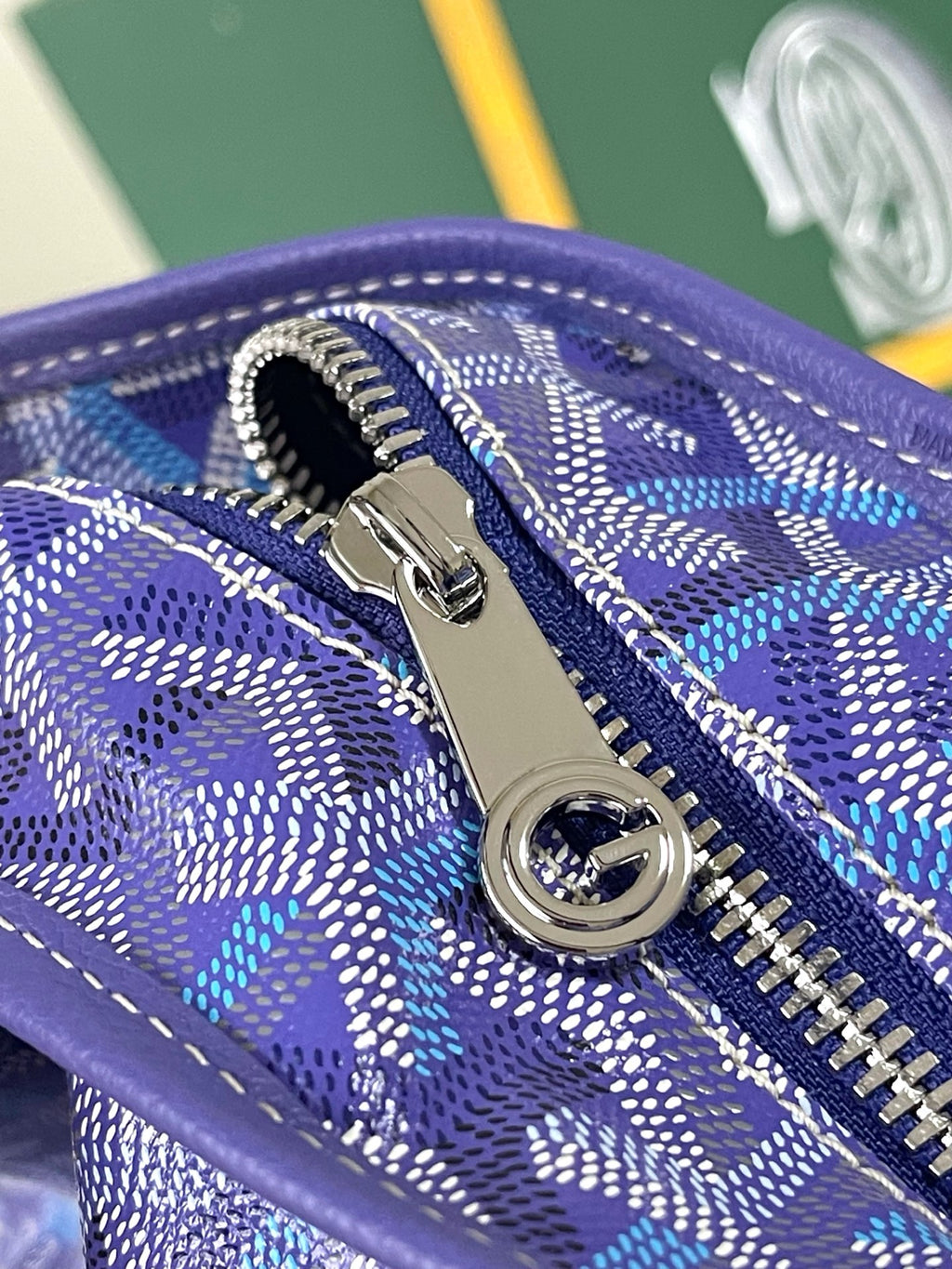 Goyard blue monogram zip pocket with silver zipper pull and ring