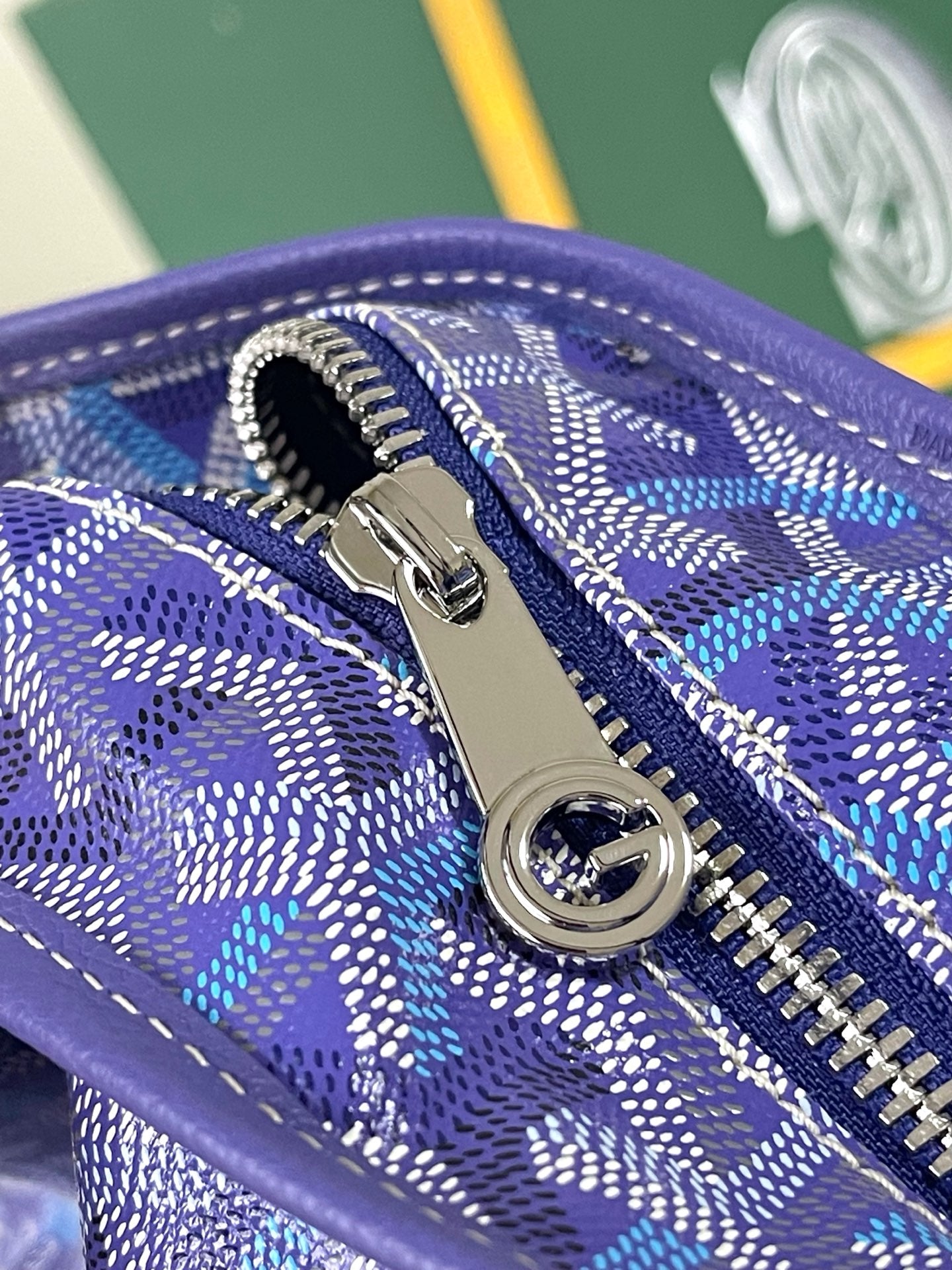 Goyard blue monogram zip pocket with silver zipper pull and ring