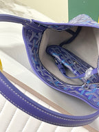 Goyard blue monogram bag interior with hanging strap and stitched lining