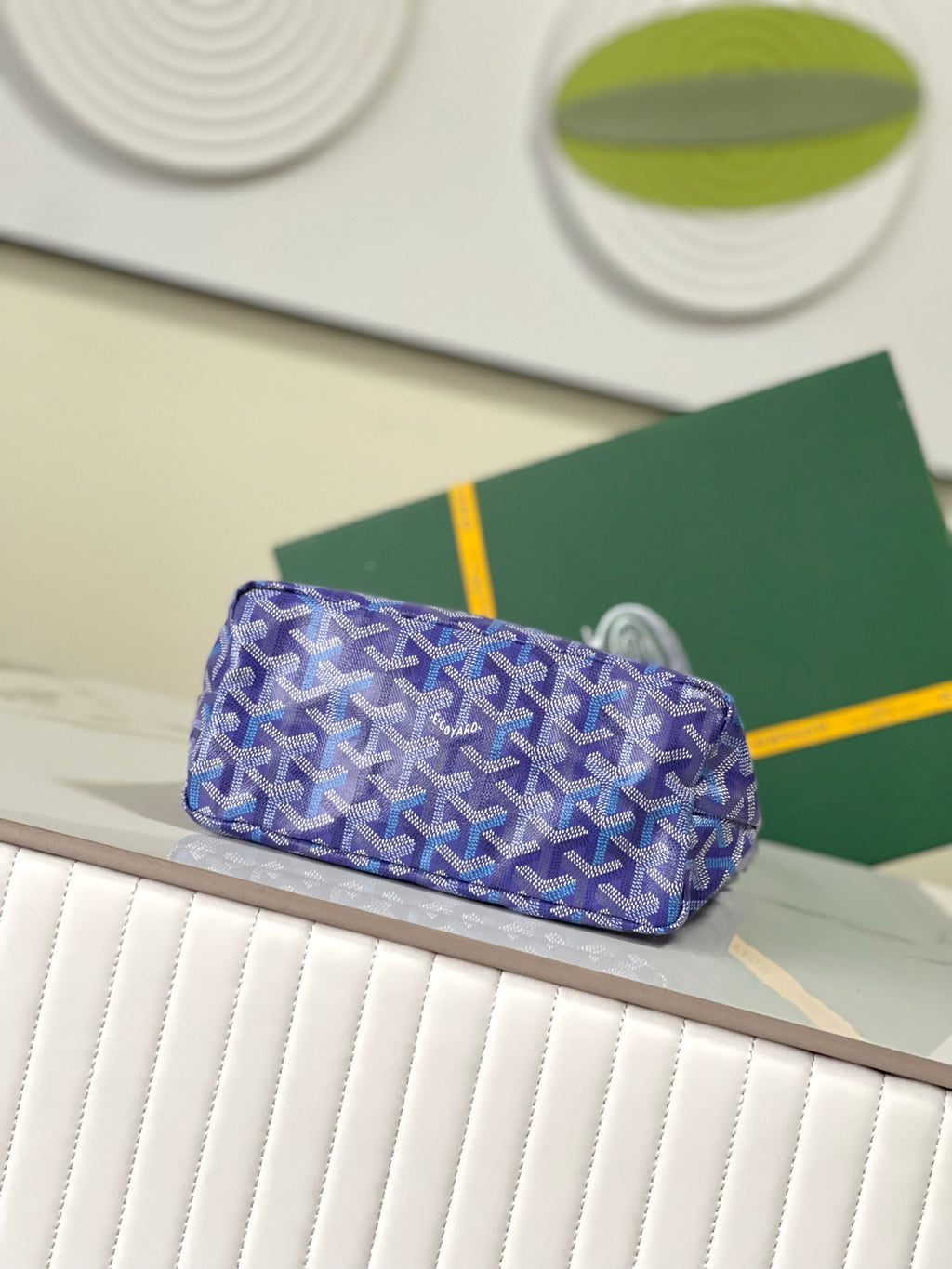 Goyard blue monogram shoulder bag with curved handle and structured silhouette