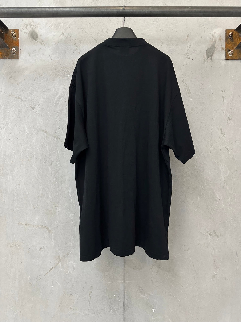 Black short-sleeve T-shirt, plain back view with relaxed drape