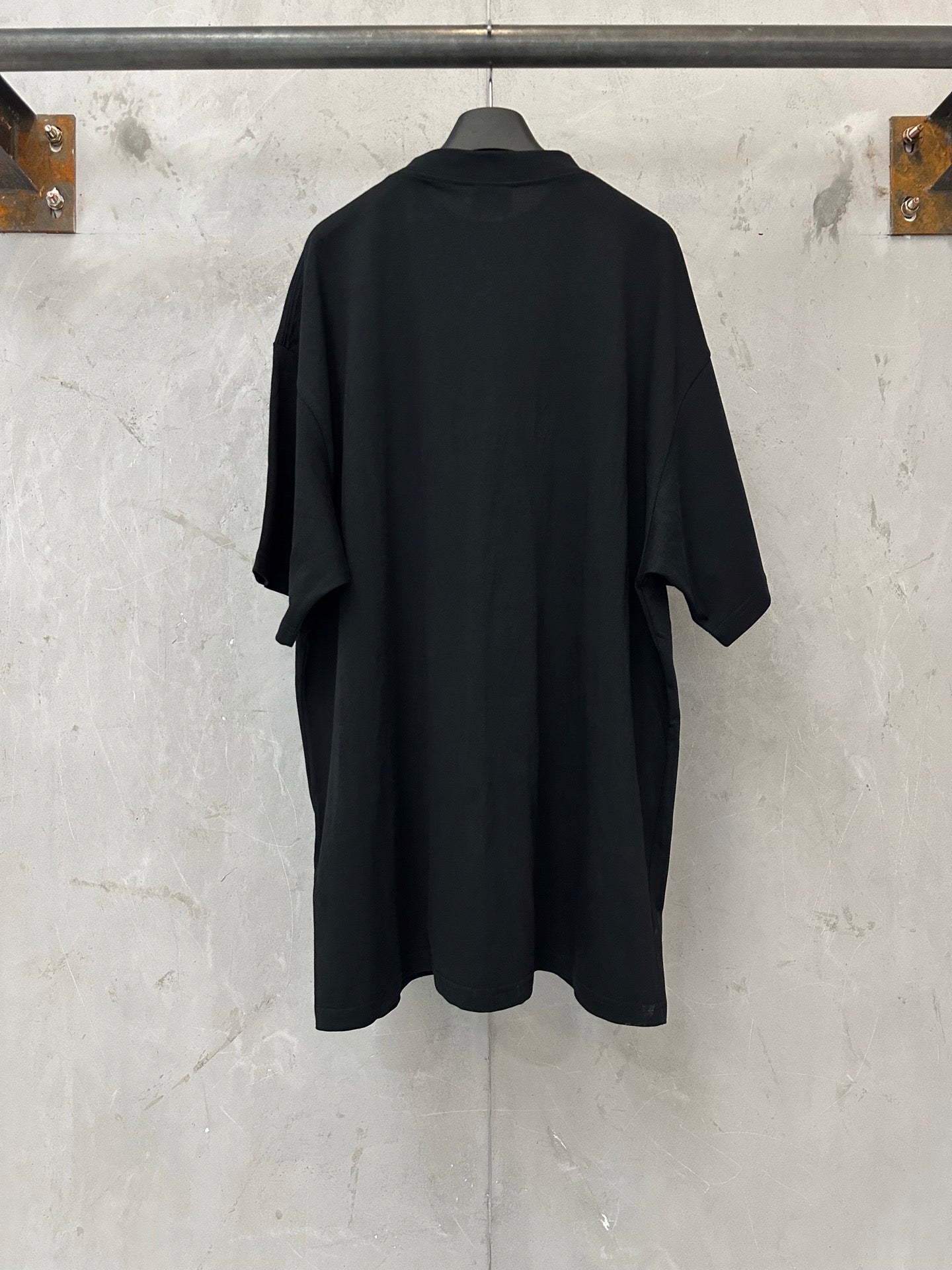 Black short-sleeve T-shirt, plain back view with relaxed drape