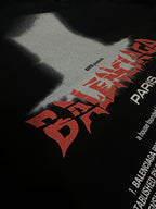 Black T-shirt close-up of red and white graphic logo text