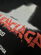 Black T-shirt close-up of red logo lettering and small text