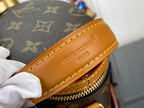 Louis Vuitton Paris embossed on tan leather trim of monogram bucket bag
