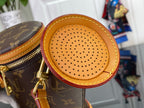 Louis Vuitton bag with monogram canvas and circular perforated leather front