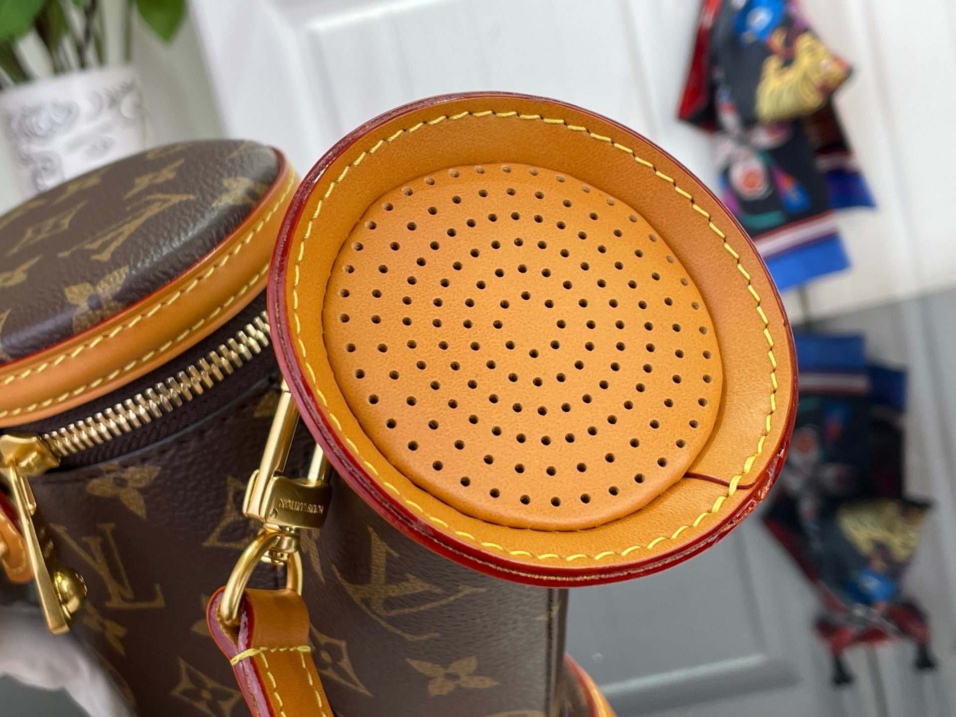 Louis Vuitton bag with monogram canvas and circular perforated leather front