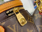 Gold zipper pull and engraved lock on Louis Vuitton monogram bag