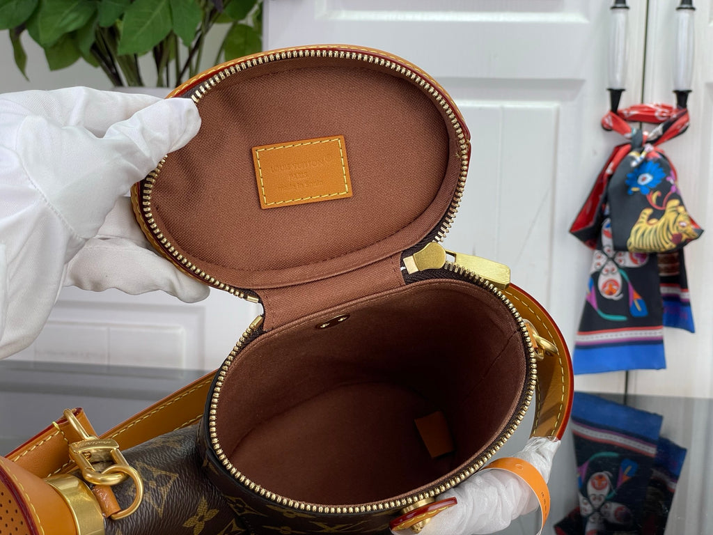 Louis Vuitton bag open with brown interior lining and front leather label