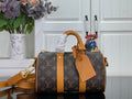 Louis Vuitton monogram canvas duffel bag with tan leather handles and strap