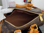 Monogram canvas duffel bag interior open, showing brown lining and zip