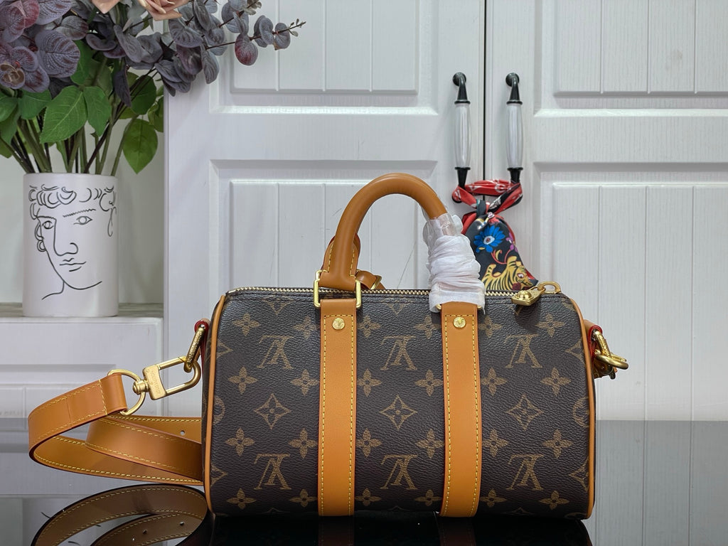 Monogram canvas duffel bag with tan leather straps and top handles