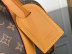 Tan leather luggage tag with embossed Louis Vuitton logo on monogram canvas