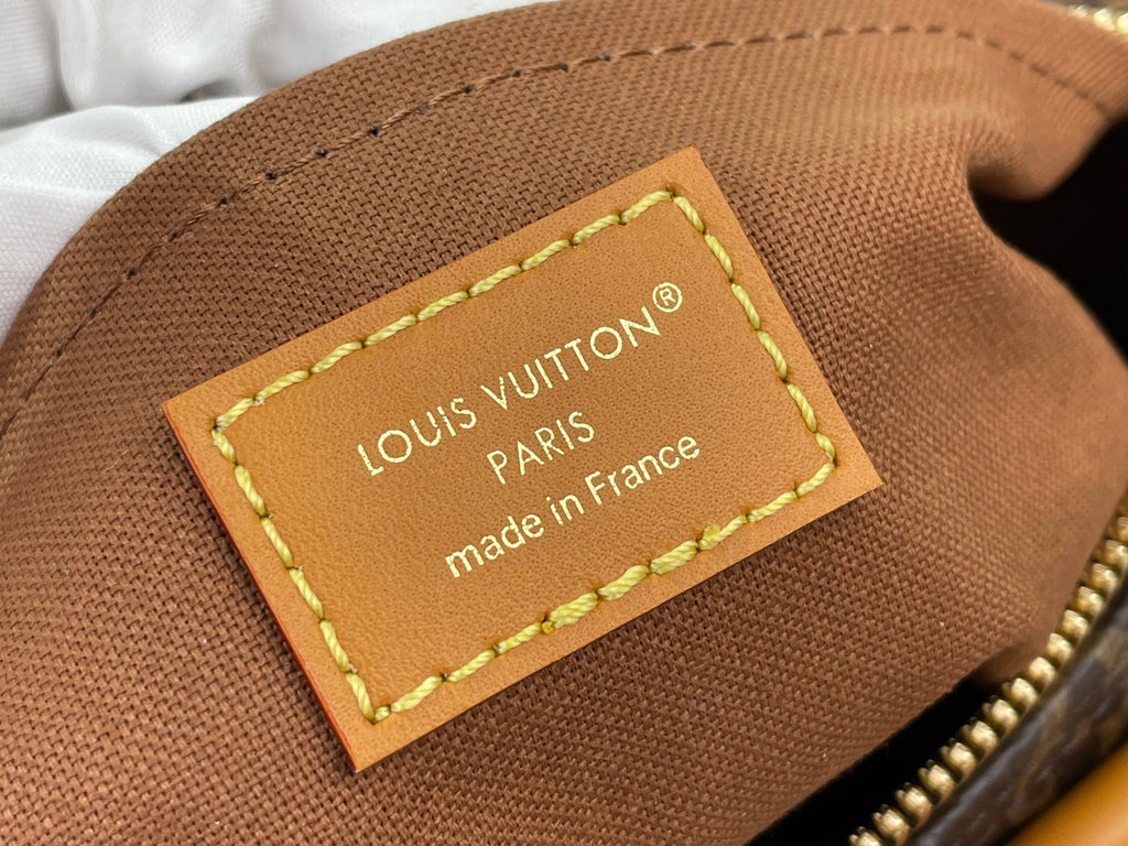 Louis Vuitton bag leather label, tan with stitched border and gold trim