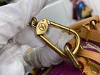 Louis Vuitton monogram bag clasp, gold hardware on purple strap