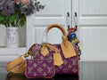 Louis Vuitton purple monogram handbag with tan leather handles and crossbody strap