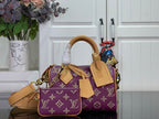 Louis Vuitton purple monogram handbag with tan leather handles and crossbody strap