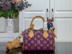 Louis Vuitton purple monogram handbag with tan top handles and side strap