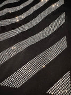 Black T-shirt close-up of rhinestone slanted stripe details