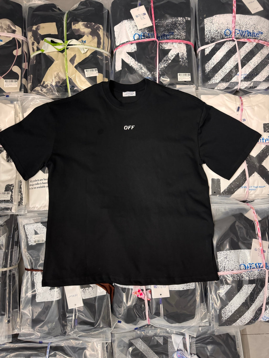 Black short-sleeve T-shirt with small chest logo print