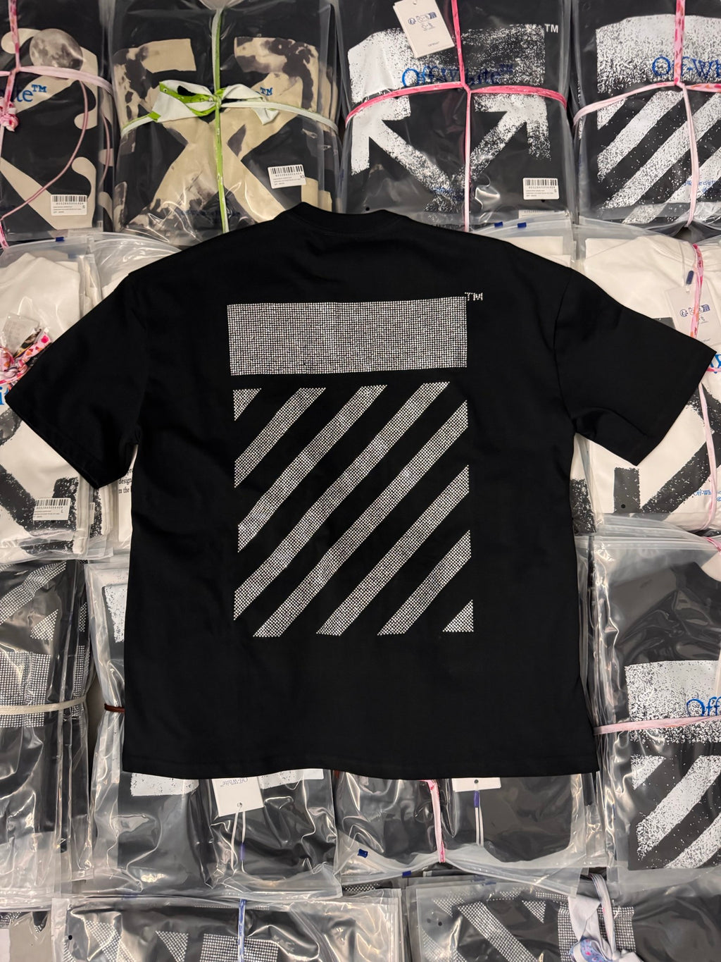 Black short-sleeve T-shirt with large rhinestone arrow stripe graphic on back