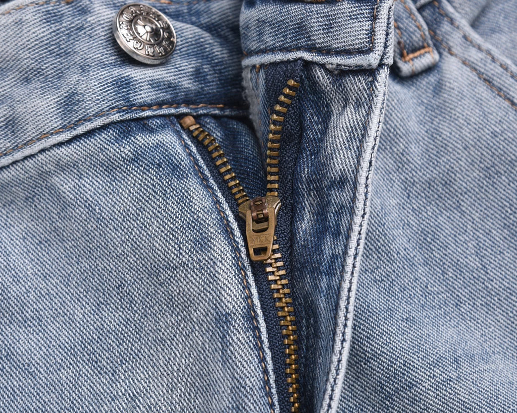 Light-wash denim shorts with metal button, belt loops, and front zipper