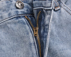 Light-wash denim shorts with metal button, belt loops, and front zipper