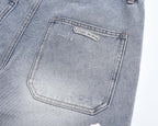Light-wash denim shorts with hexagonal label on back pocket