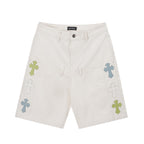 White shorts with multicolor cross patches and front button closure