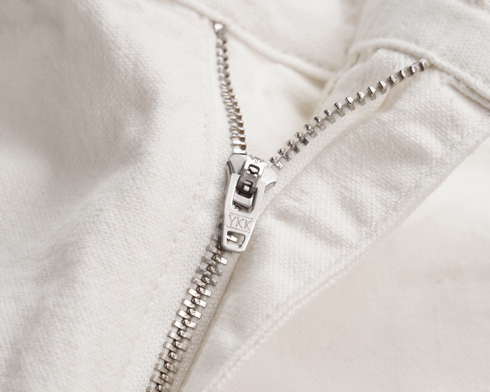 White shorts with metal zipper and button fly