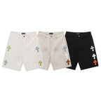 Set of cross-print shorts in white, beige, and black