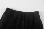 Black shorts with gathered elastic waistband and inner drawstring