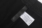 Black shorts with woven care label tag at waistband