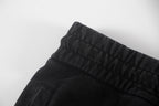 Black shorts waistband and stitched side pocket edge