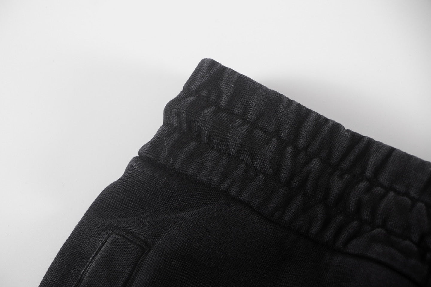 Black shorts waistband and stitched side pocket edge
