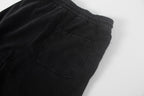 Black shorts with square front pocket and elastic waistband