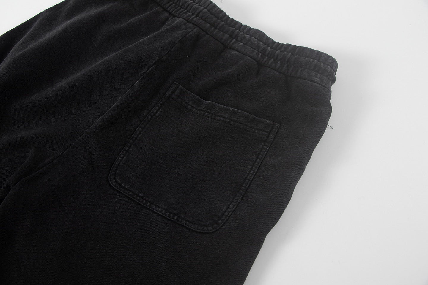Black shorts with square front pocket and elastic waistband