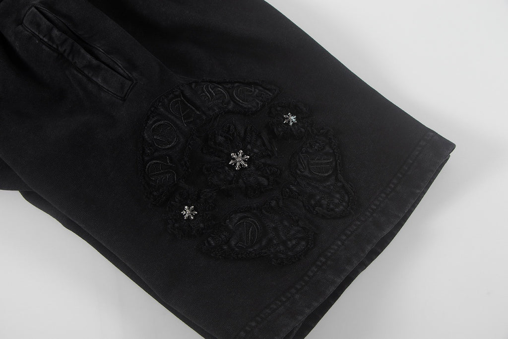 Black shorts with ornate embroidered center side patch
