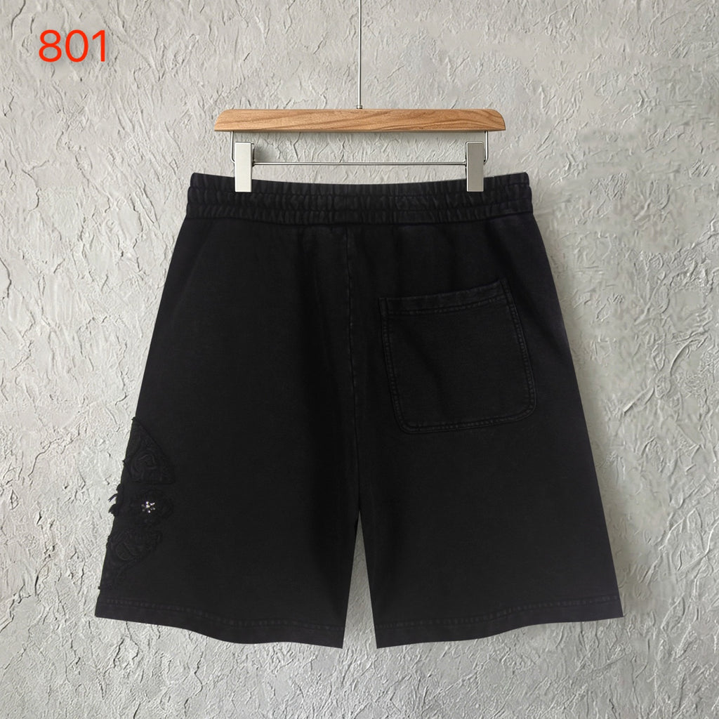 Black shorts with elastic waistband and front welt pocket