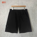Black shorts with elastic waistband and front welt pocket