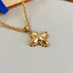 Gold-tone chain necklace with large butterfly pendant