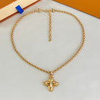 Gold-tone heart-shaped chain necklace with butterfly pendant