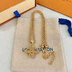 Gold-tone chain necklaces with monogram flower pendants