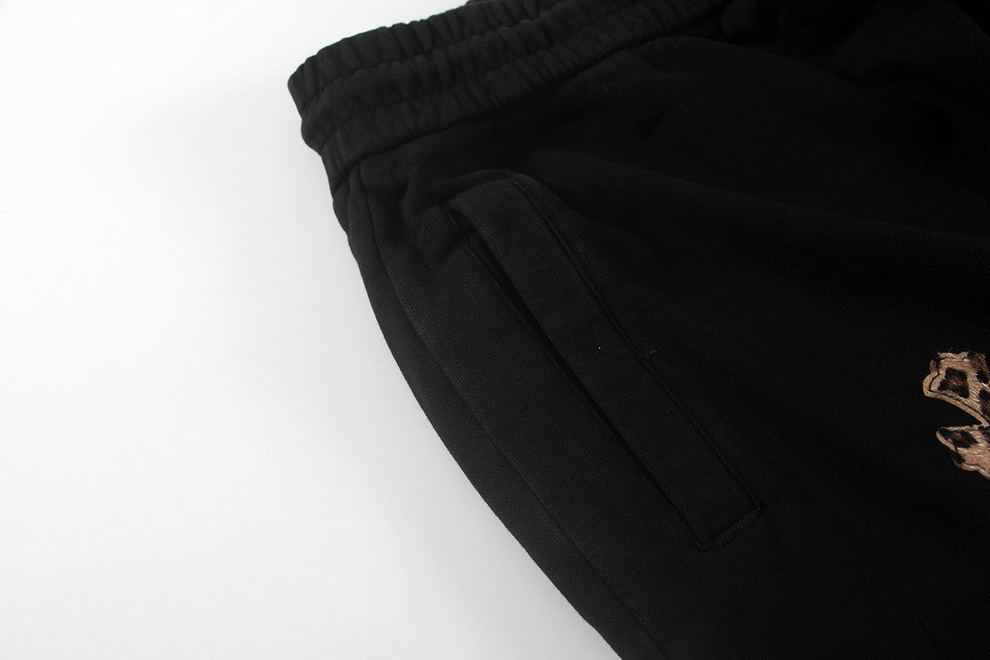 Black shorts with side pocket seam and pleated front detail