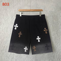 Black shorts with elastic waistband and scattered cross appliques, front view